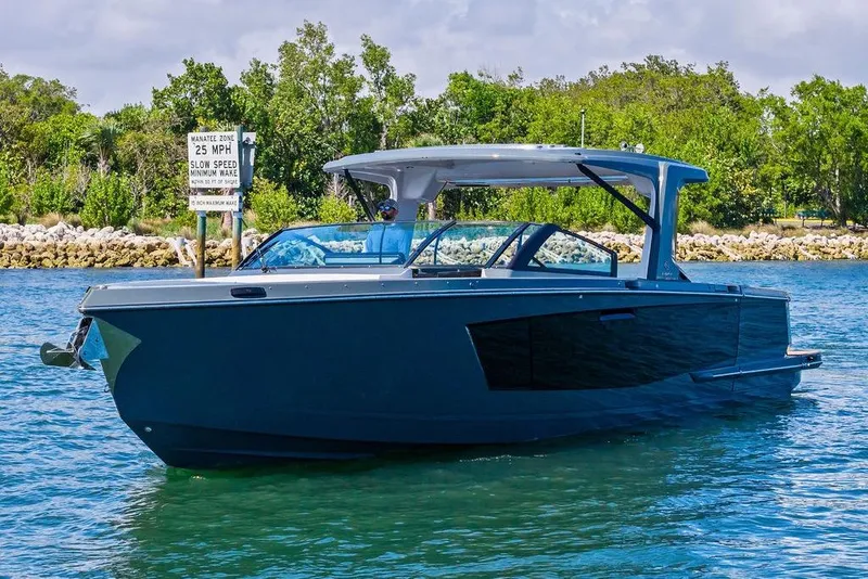 Slide: The Image of 2022 Aviara AV40 OB boat cruising on a sunny day near a speed limit sign. - 9