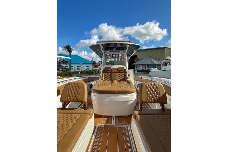 Slide: The Image of 2022 Invincible 39 Open Fisherman boat with luxurious seating and clear blue sky. - 17