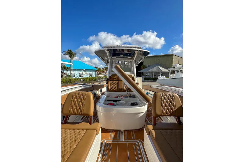 Slide: The Image of 2022 Invincible 39 Open Fisherman boat with luxurious seating and clear blue sky. - 18