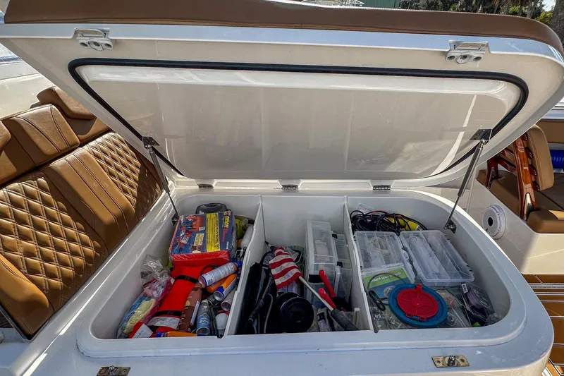 Slide: The Image of Storage compartment of 2022 Invincible 39 Open Fisherman boat, filled with fishing gear and supplies. - 19