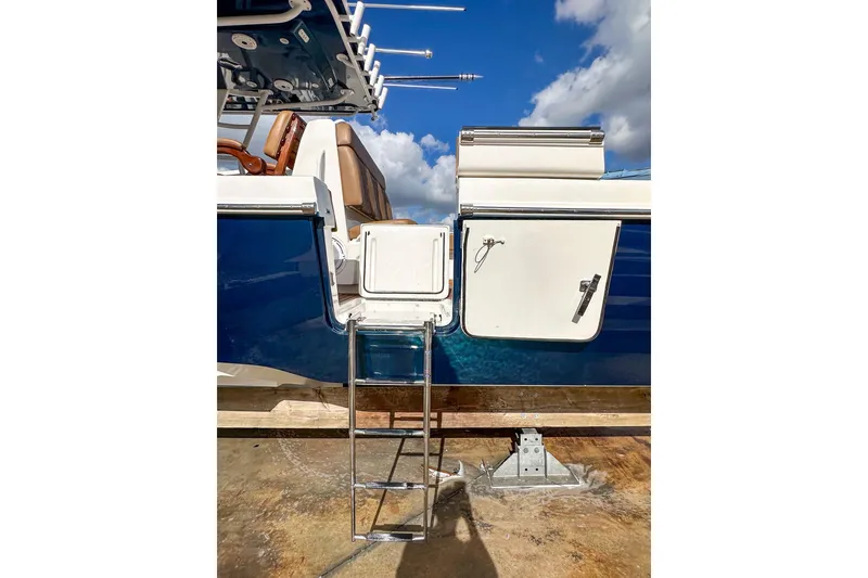 Slide: The Image of 2022 Invincible 39 Open Fisherman boat with ladder and storage compartments. - 20