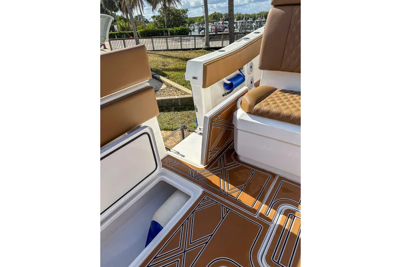 Slide: The Image of 2022 Invincible 39 Open Fisherman boat interior with stylish seating and patterned flooring. - 22