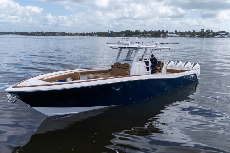 Slide: The Image of 2022 Invincible 39 Open Fisherman boat on calm water, featuring sleek design and modern amenities. - 36