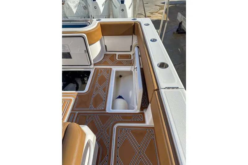 Slide: The Image of 2022 Invincible 39 Open Fisherman boat interior with stylish deck design and storage compartments. - 4