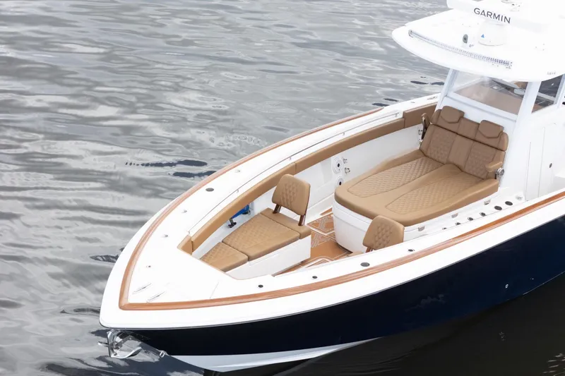 Slide: The Image of 2022 Invincible 39 Open Fisherman boat with tan seating on calm water. - 43