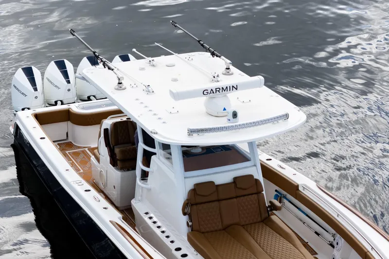 Slide: The Image of 2022 Invincible 39 Open Fisherman boat with Garmin equipment on calm water. - 44