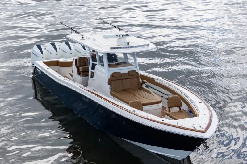 Slide: The Image of 2022 Invincible 39 Open Fisherman boat with sleek design and powerful engines on water. - 45