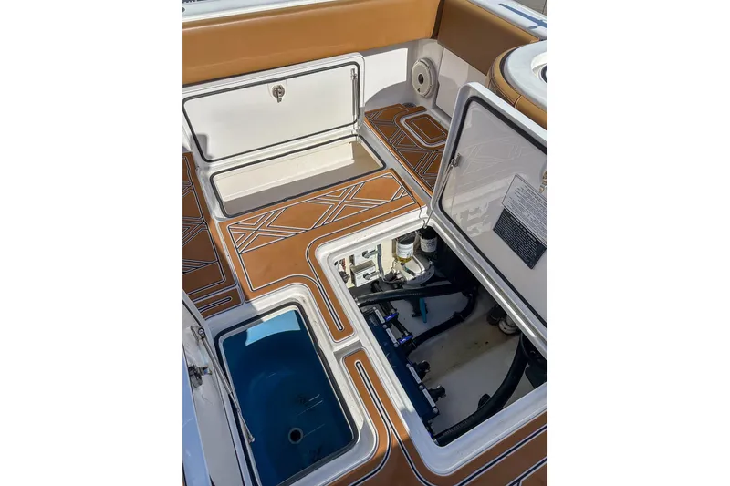 Slide: The Image of 2022 Invincible 39 Open Fisherman boat deck with open storage compartments. - 5