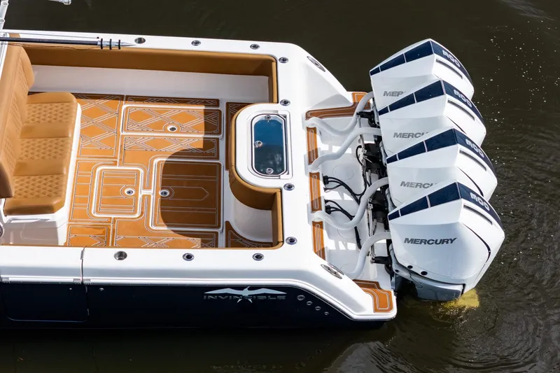 Slide: The Image of 2022 Invincible 39 Open Fisherman boat with four Mercury engines, featuring a stylish deck design. - 50