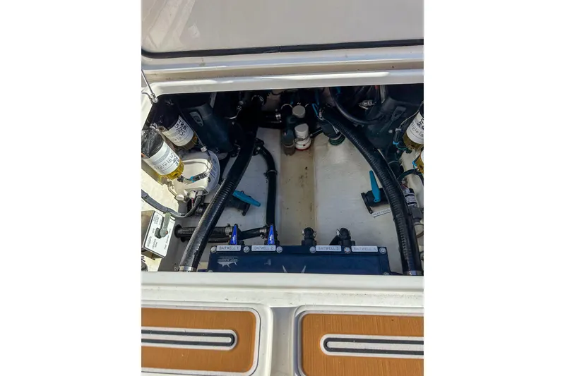 Slide: The Image of Engine compartment of 2022 Invincible 39 Open Fisherman boat, showcasing mechanical components. - 6