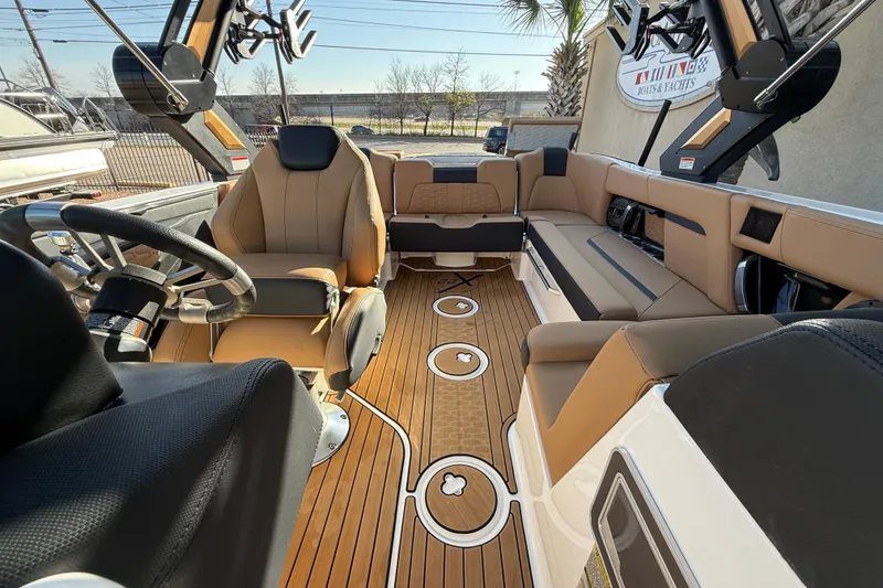 Slide: The Image of 2023 MasterCraft X22 boat interior with luxurious seating and modern design. - 13