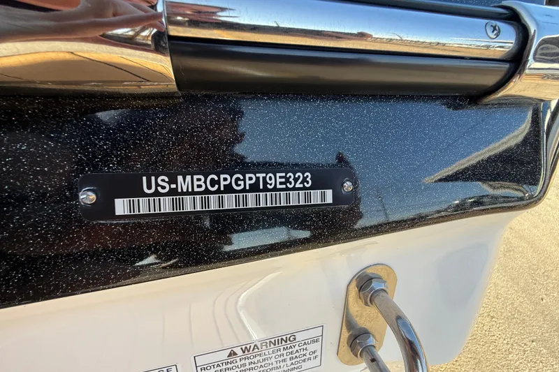 Slide: The Image of 2023 MasterCraft X22 boat with visible hull identification number and warning label. - 17