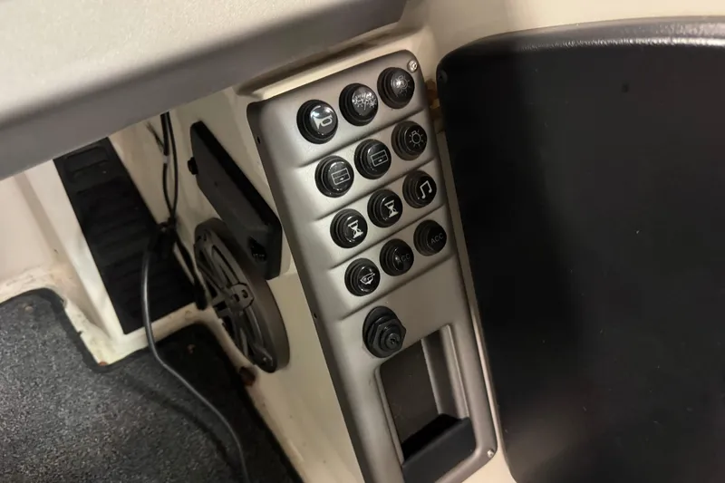 Slide: The Image of Control panel of 2023 Ranger 1850MS boat with various buttons and switches. - 10