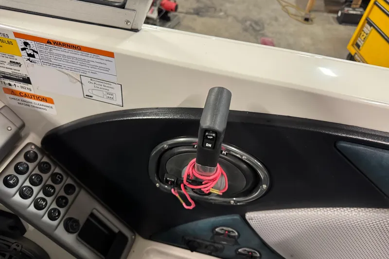 Slide: The Image of Control panel of 2023 Ranger 1850MS boat with warning labels and switches. - 11