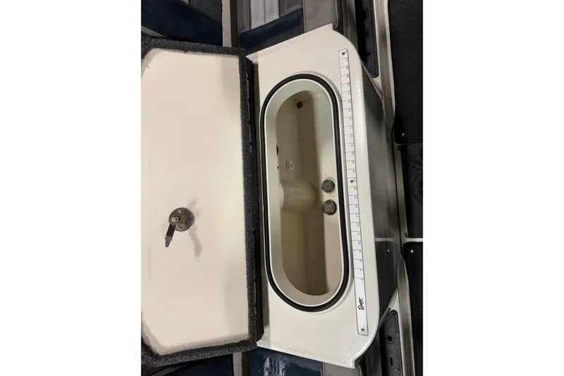 Slide: The Image of 2023 Ranger 1850MS boat livewell with measuring scale and open lid. - 14