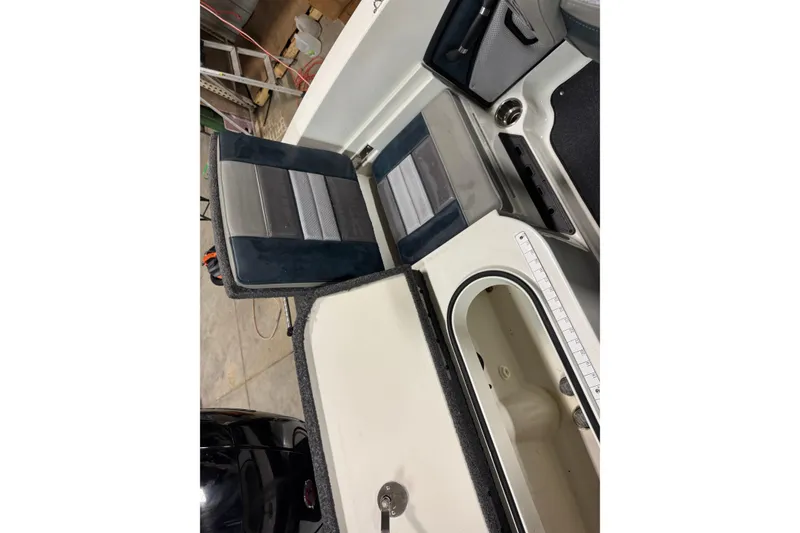 Slide: The Image of 2023 Ranger 1850MS boat interior with seating and storage compartments. - 15