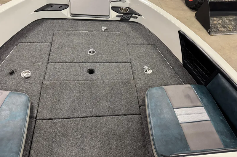 Slide: The Image of 2023 Ranger 1850MS boat interior with gray carpet and seating. - 18