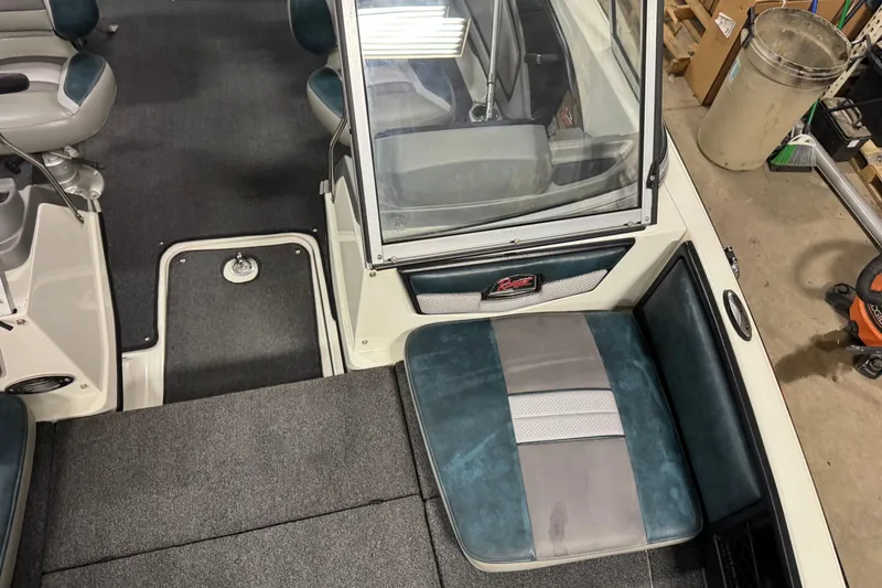 Slide: The Image of Interior of 2023 Ranger 1850MS boat with seating and storage compartments. - 21