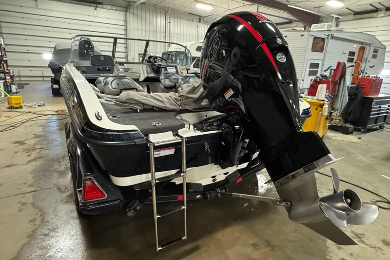 Slide: The Image of 2023 Ranger 1850MS boat in garage with powerful outboard motor. - 4