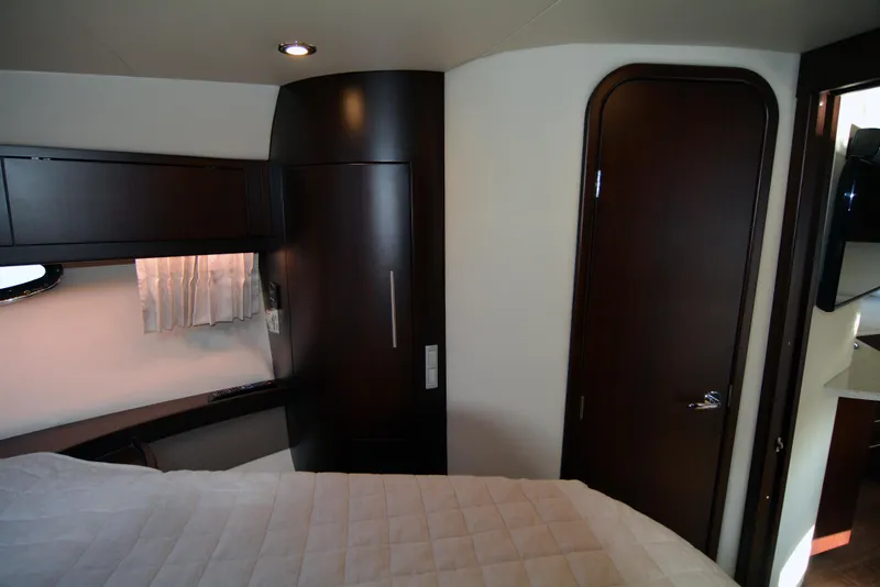 Slide: The Image of Interior cabin of 2018 Regal 46 Sport Coupe with modern wood finishes. - 19