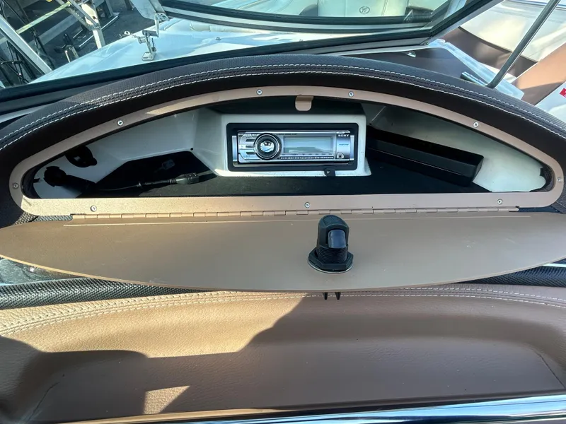 Slide: The Image of 2012 Cobalt 210 WSS boat dashboard with stereo system. - 8