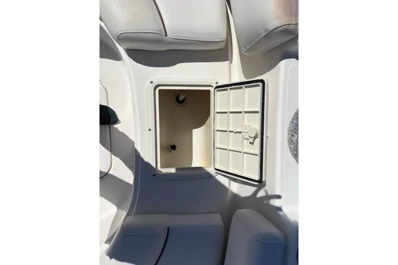 Slide: The Image of Open storage compartment on 2013 Hurricane SunDeck Sport 188 OB boat. - 12