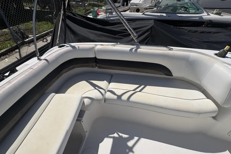 Slide: The Image of 2013 Hurricane SunDeck Sport 188 OB boat interior with white seating and cup holders. - 6