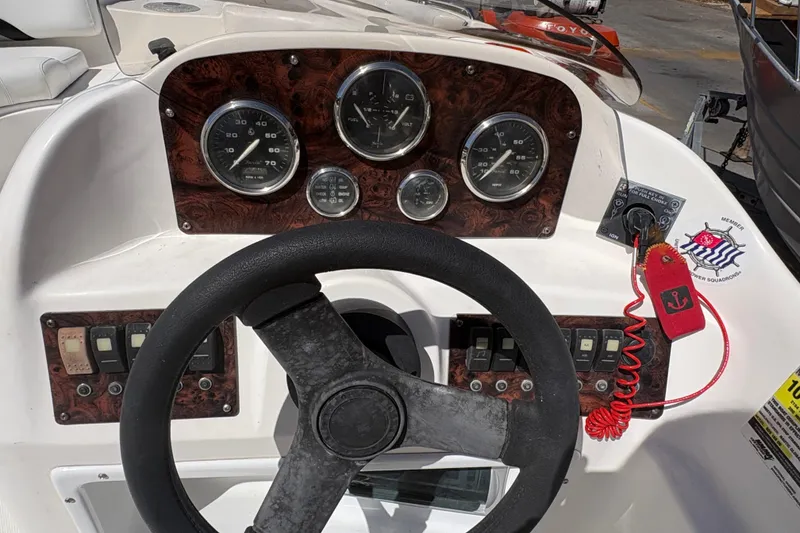 Slide: The Image of 2013 Hurricane SunDeck Sport 188 OB dashboard with steering wheel and gauges. - 8