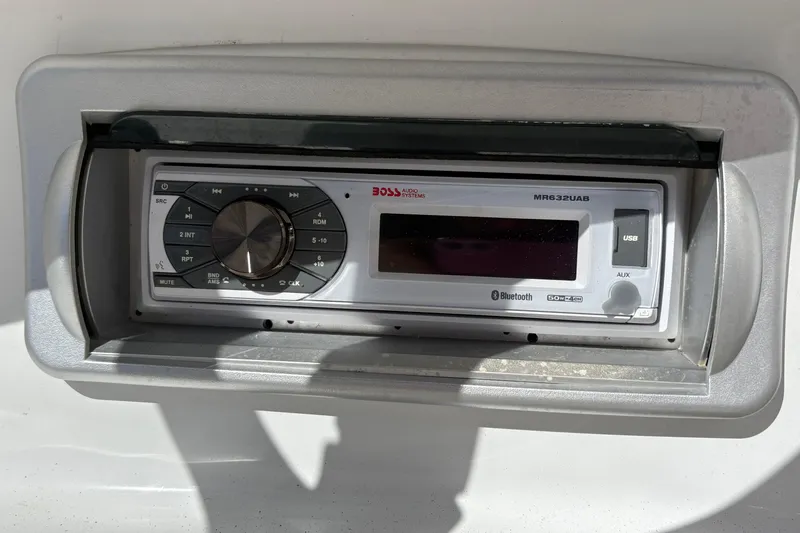 Slide: The Image of Boat stereo system on 2013 Hurricane SunDeck Sport 188 OB, featuring Bluetooth and USB connectivity. - 9