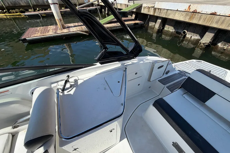 Slide: The Image of Interior view of a 2022 Monterey M-65 boat docked by the water. - 12
