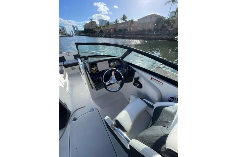 Slide: The Image of Cockpit view of 2022 Monterey M-65 boat, featuring sleek design and modern controls. - 8