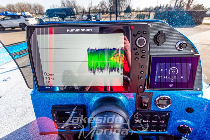 Slide: The Image of 2024 Recon 985 SC boat dashboard with Humminbird sonar display and controls. - 21