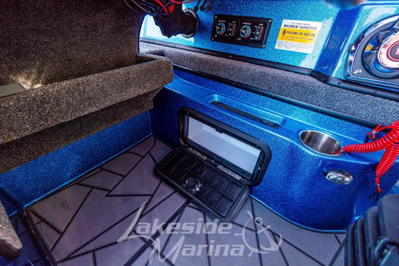 Slide: The Image of 2024 Recon 985 SC boat interior with control panel and seating area. - 25