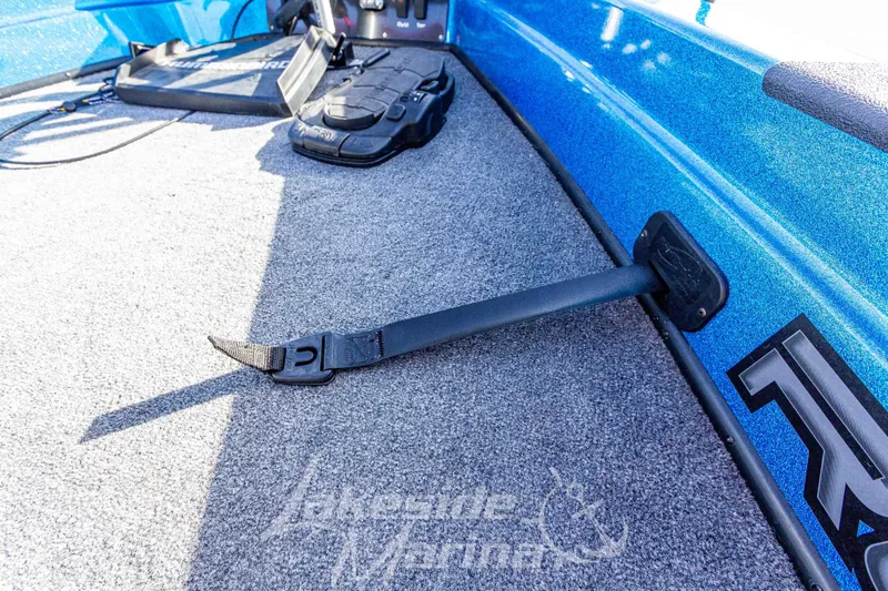 Slide: The Image of 2024 Recon 985 SC boat interior with blue finish and secure strap detail. - 34