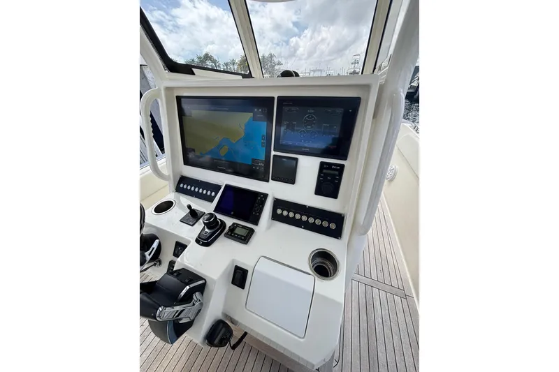 Slide: The Image of Control panel of 2018 Ocean 1 R boat with navigation screens and controls. - 10