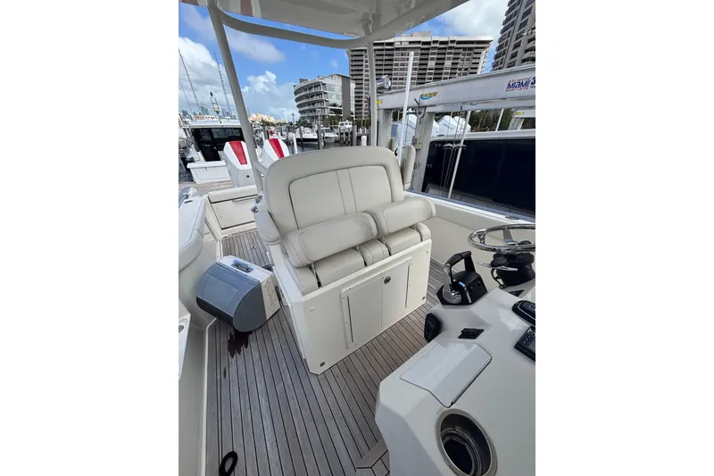 Slide: The Image of Luxury Ocean 1 R 2018 boat interior with white seating and modern controls. - 11