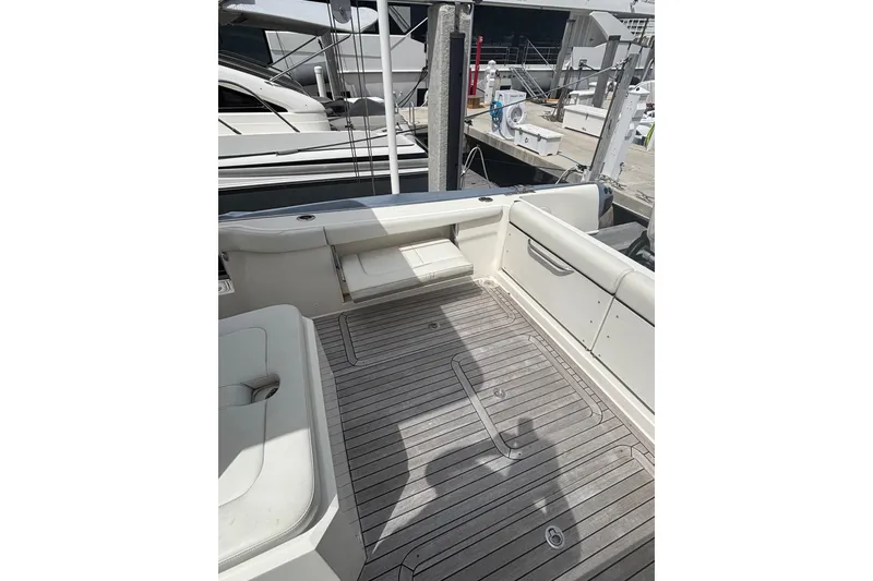 Slide: The Image of 2018 Ocean 1 R boat deck with seating, docked at marina. - 19