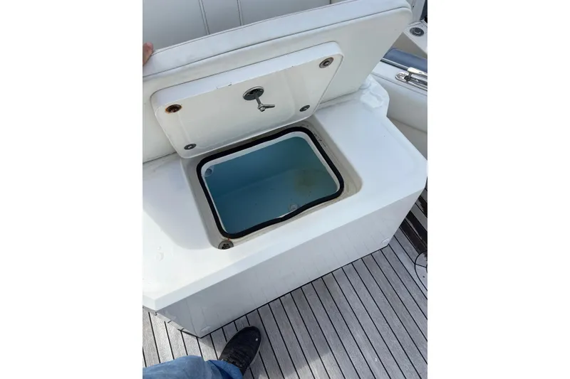 Slide: The Image of Open storage compartment on Ocean 1 R boat, 2018 model, with visible interior. - 8