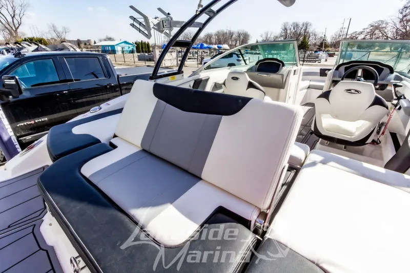 Slide: The Image of 2023 Chaparral 21 Surf boat interior with sleek seating and modern design. - 14