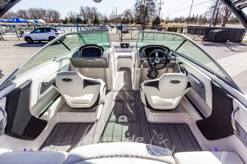 Slide: The Image of 2023 Chaparral 21 Surf boat interior with modern dashboard and seating. - 16