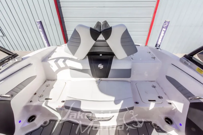 Slide: The Image of 2023 Chaparral 21 Surf boat interior with sleek seating and modern design. - 18