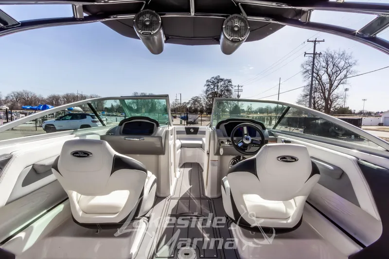 Slide: The Image of 2023 Chaparral 21 Surf boat interior with modern dashboard and seating. - 23
