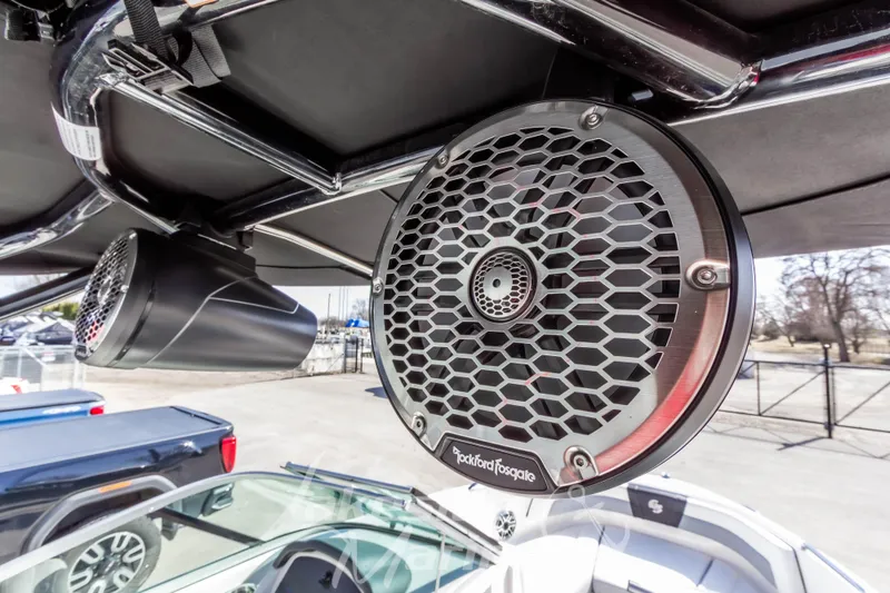 Slide: The Image of 2023 Chaparral 21 Surf boat with Rockford Fosgate speakers, showcasing premium audio setup. - 25