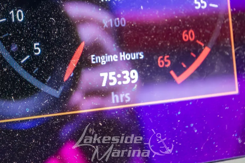 Slide: The Image of Dashboard of 2023 Chaparral 21 Surf showing 75:39 engine hours. - 27