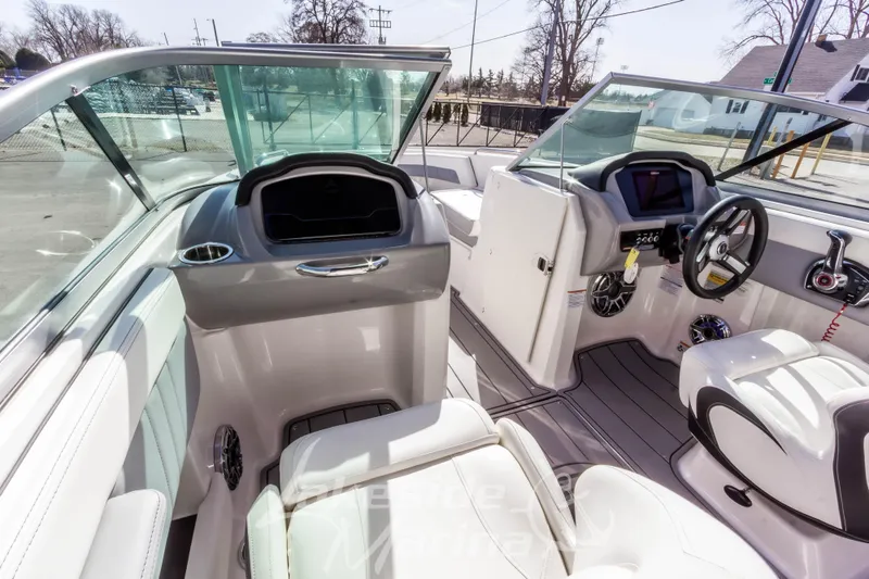 Slide: The Image of 2023 Chaparral 21 Surf boat interior with modern dashboard and seating. - 28