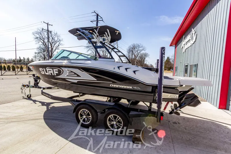 Slide: The Image of 2023 Chaparral 21 Surf boat on trailer at Lakeside Marina, side view. - 7