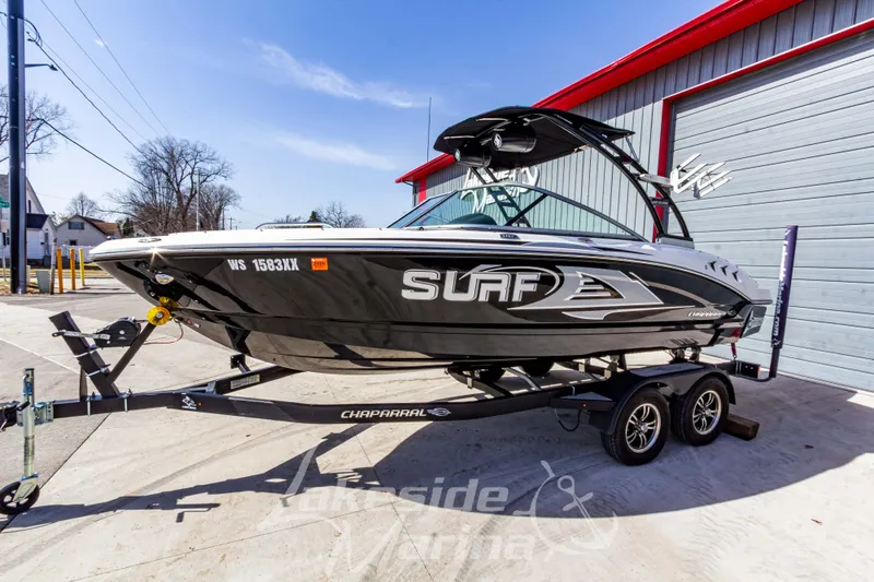 Slide: The Image of 2023 Chaparral 21 Surf boat on trailer outside Lakeside Marina. - 9