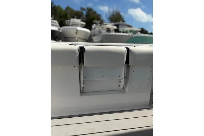 Slide: The Image of 2024 Tidewater 3100 Carolina Bay boat interior detail with cushioned seating. - 13