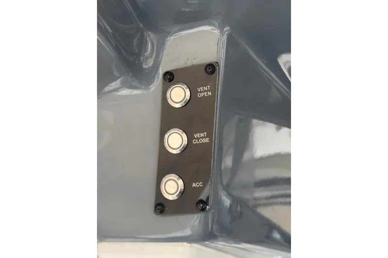Slide: The Image of Control panel with buttons labeled "Vent Open," "Vent Close," and "ACC" on 2024 Tidewater 3100 Carolina Bay. - 19