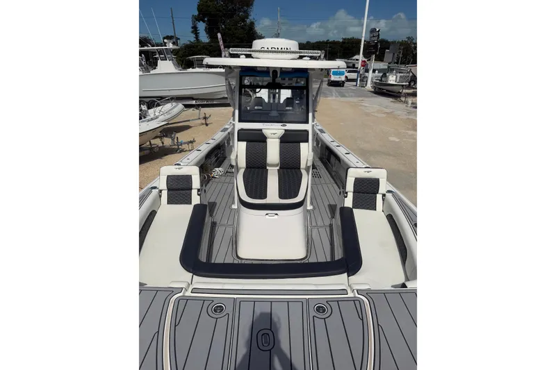 Slide: The Image of 2024 Tidewater 3100 Carolina Bay boat with sleek seating and modern design. - 22